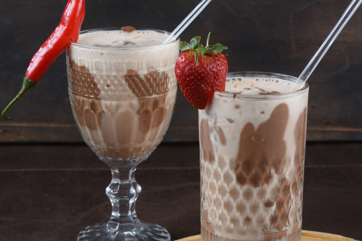 chocolate drink with milk and alcoholic amarula with strawberry